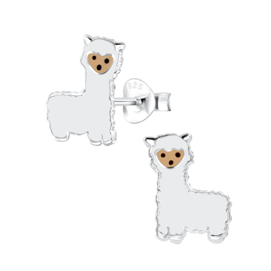 a pair of white llama earrings with a brown face