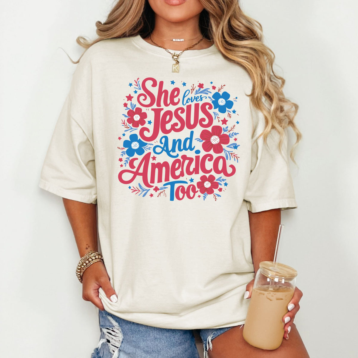 Ivory T-shirt with She Loves Jesus and America Too red and blue floral graphic