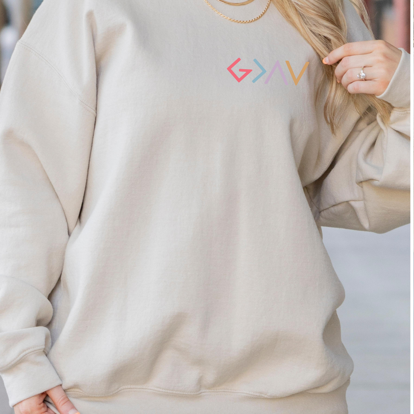 God is Greater Than the Highs and Lows Women's Sweatshirt (left chest)