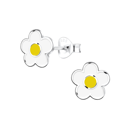 a pair of white and yellow flower shaped earrings