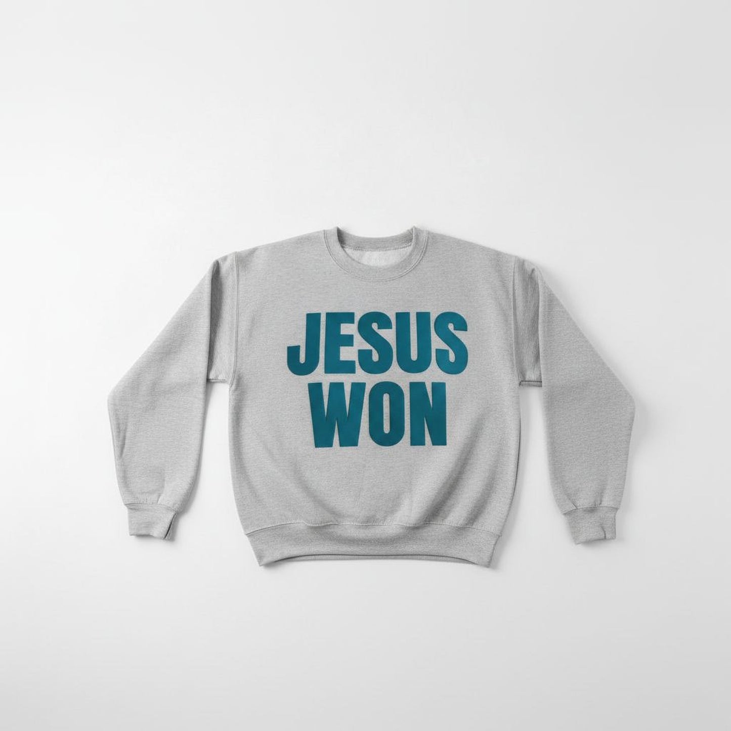 A gray sweatshirt with the text "JESUS WON" printed on it in teal blue letters.