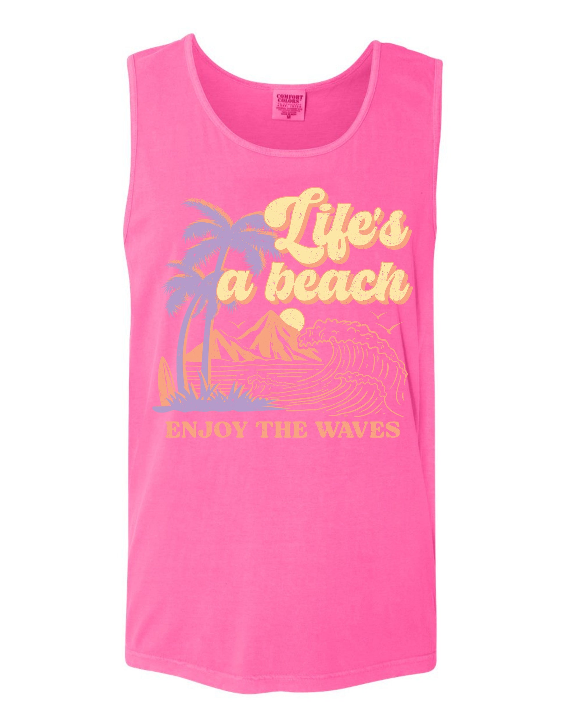 A pink tank top with a graphic design featuring palm trees, mountains, and the text "Life's a beach" and "Enjoy the waves" printed on it.