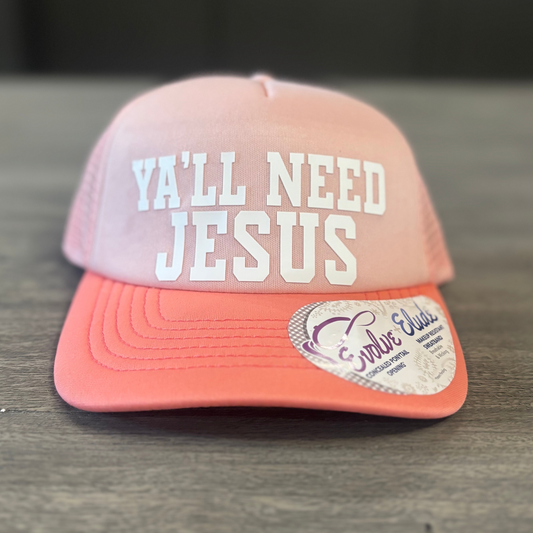 A pink baseball cap with the text "Ya'll need Jesus" printed on it.