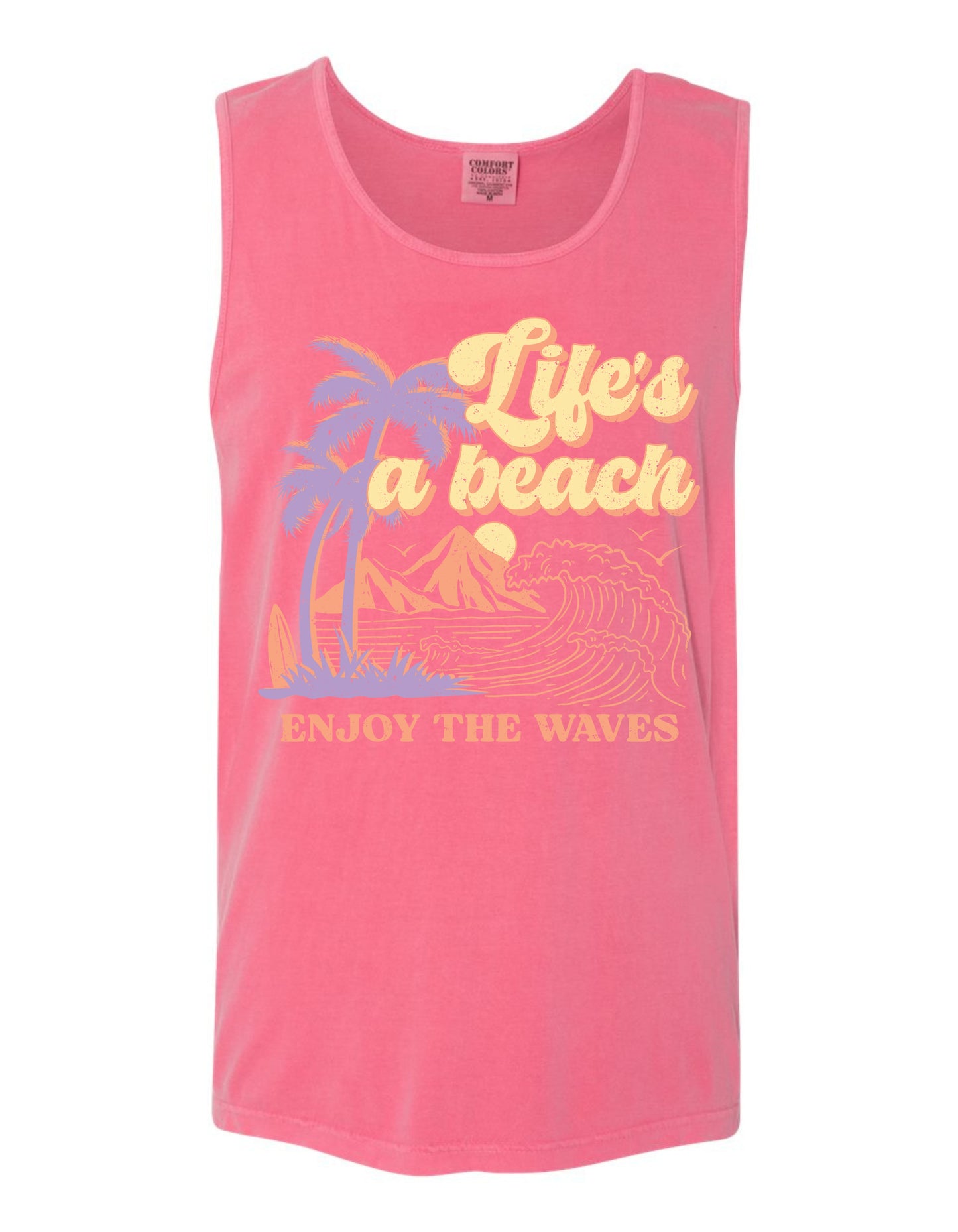 A pink tank top with a graphic design depicting palm trees, mountains, and waves, along with the text "Life's a beach, Enjoy the waves" printed on it.