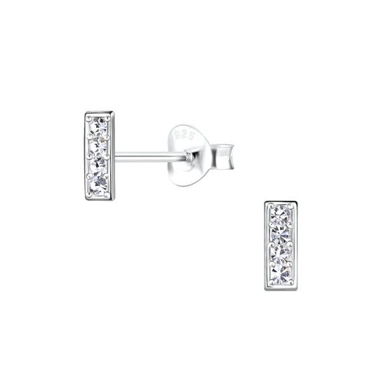 a pair of diamond earrings on a white background