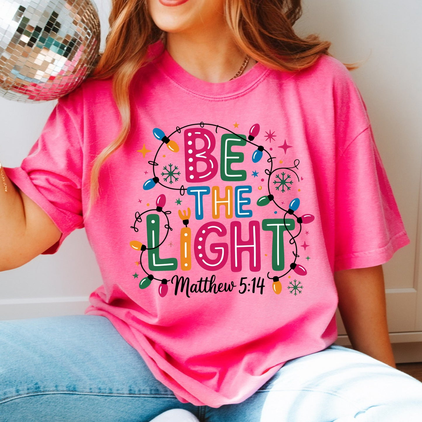 Be The Light – Matthew 5:14 Christmas Lights Comfort Colors Tee