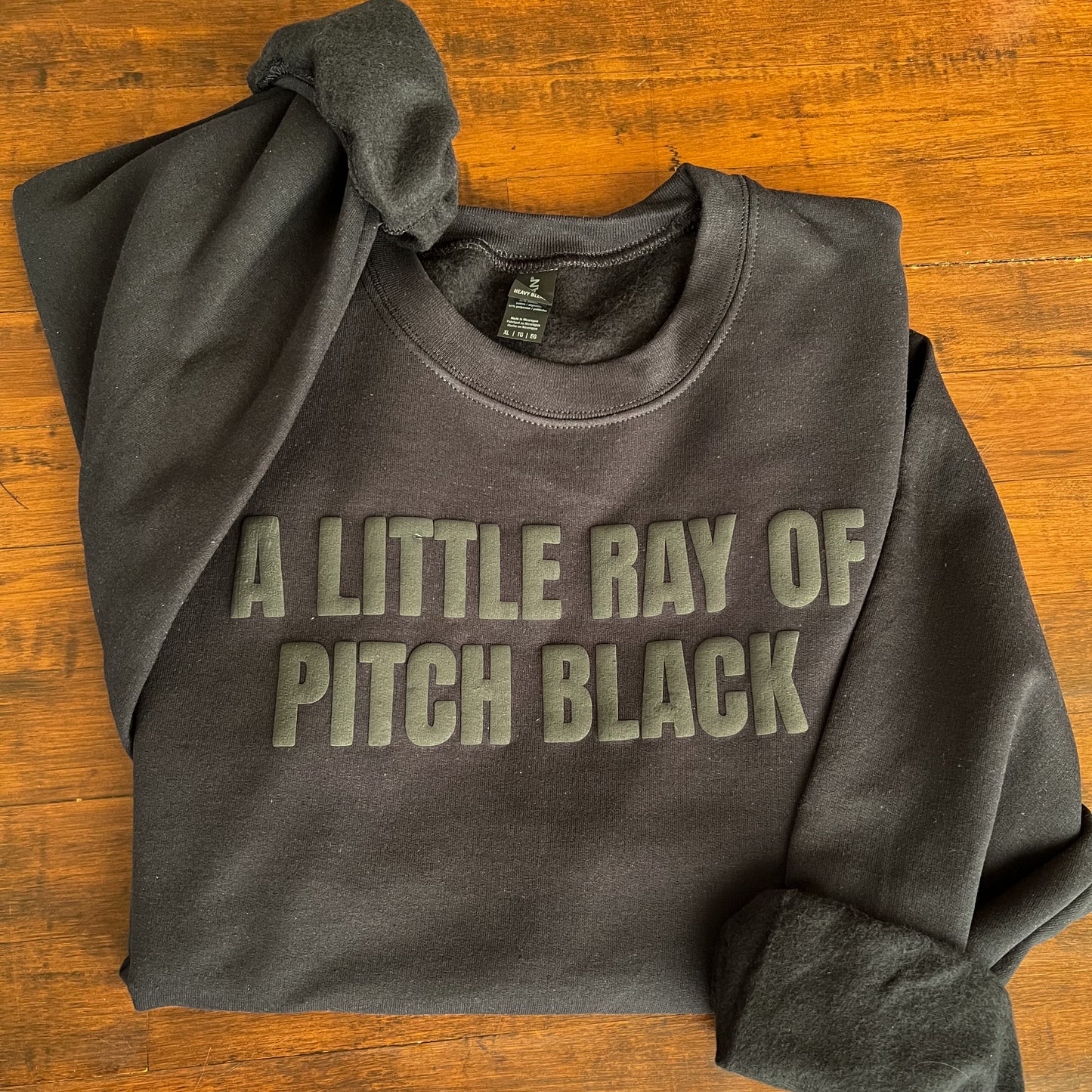 A Little Ray of Pitch Black Sweatshirt