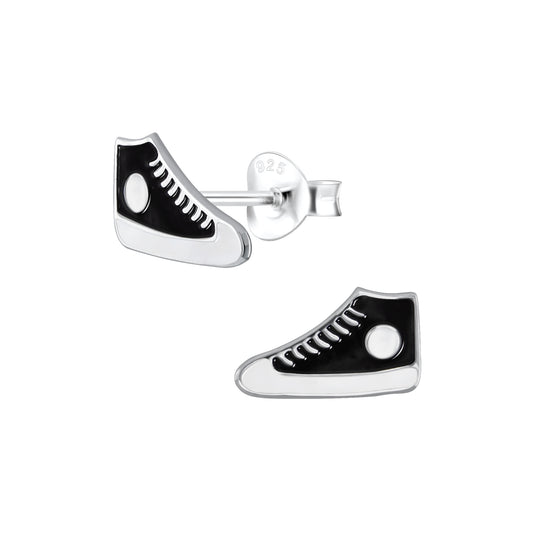 a pair of black and white shoes on a white background