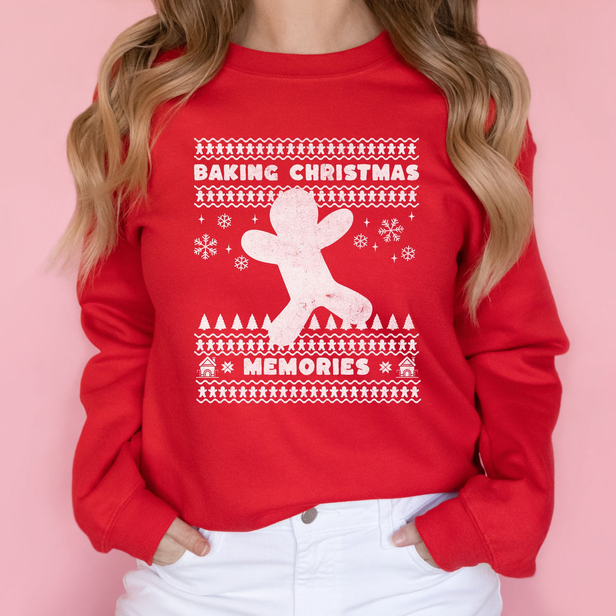 Woman wearing a red Baking Christmas Memories reindeer sweatshirt.