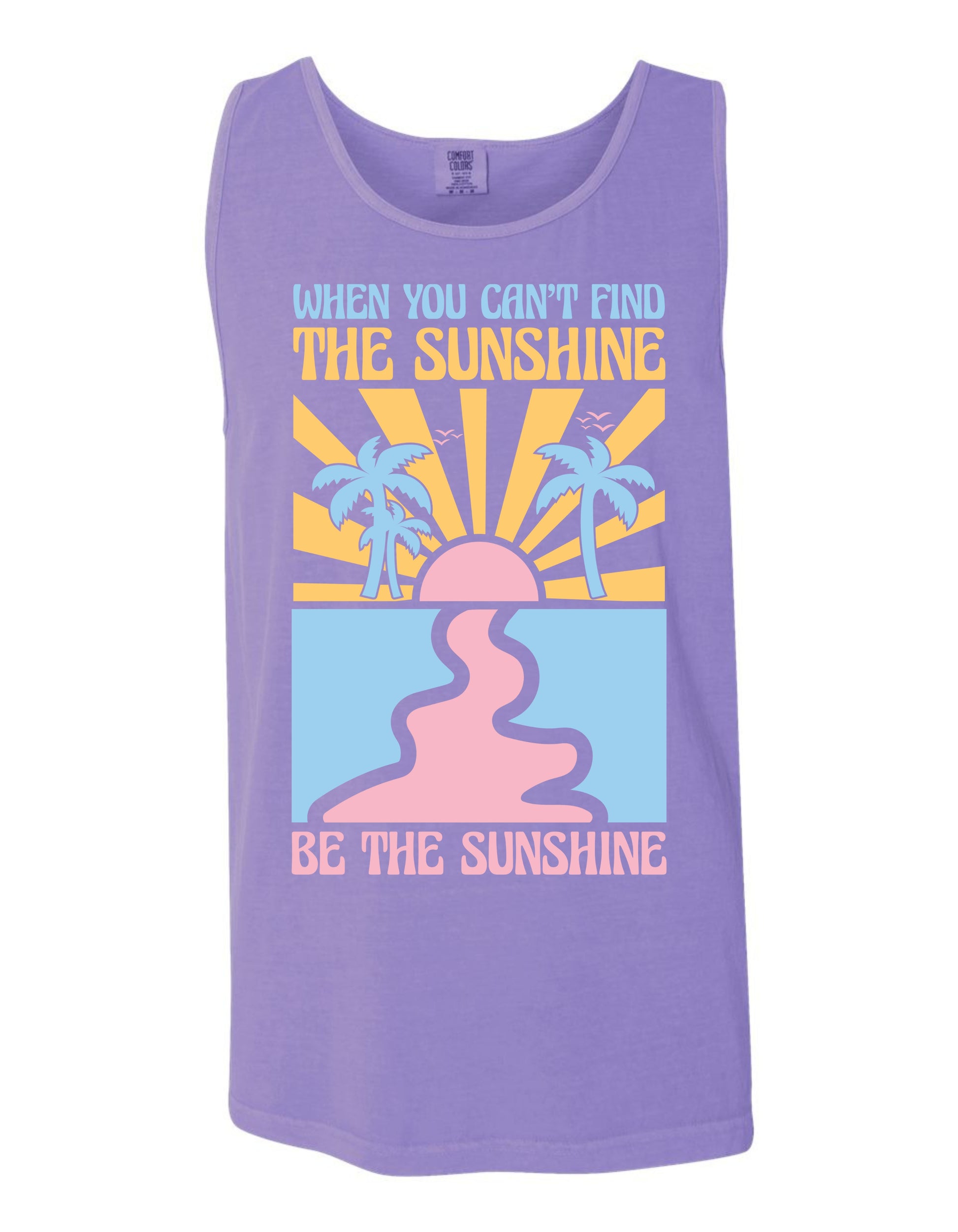 The image is a purple tank top with a graphic design featuring a sun and palm trees, along with the text "When you can't find the sunshine, be the sunshine" printed on it.