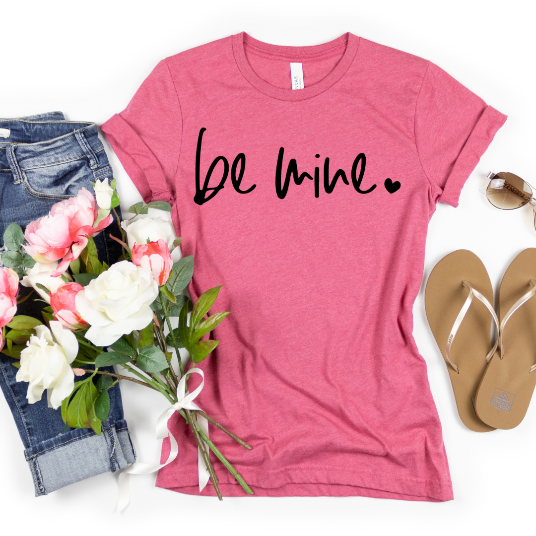 Woman wearing a Raspberry Be Mine graphic T-shirt