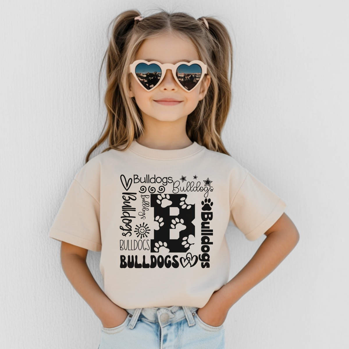 Bulldogs B collage design on Natural Bella Canvas 3001Y youth T-shirt