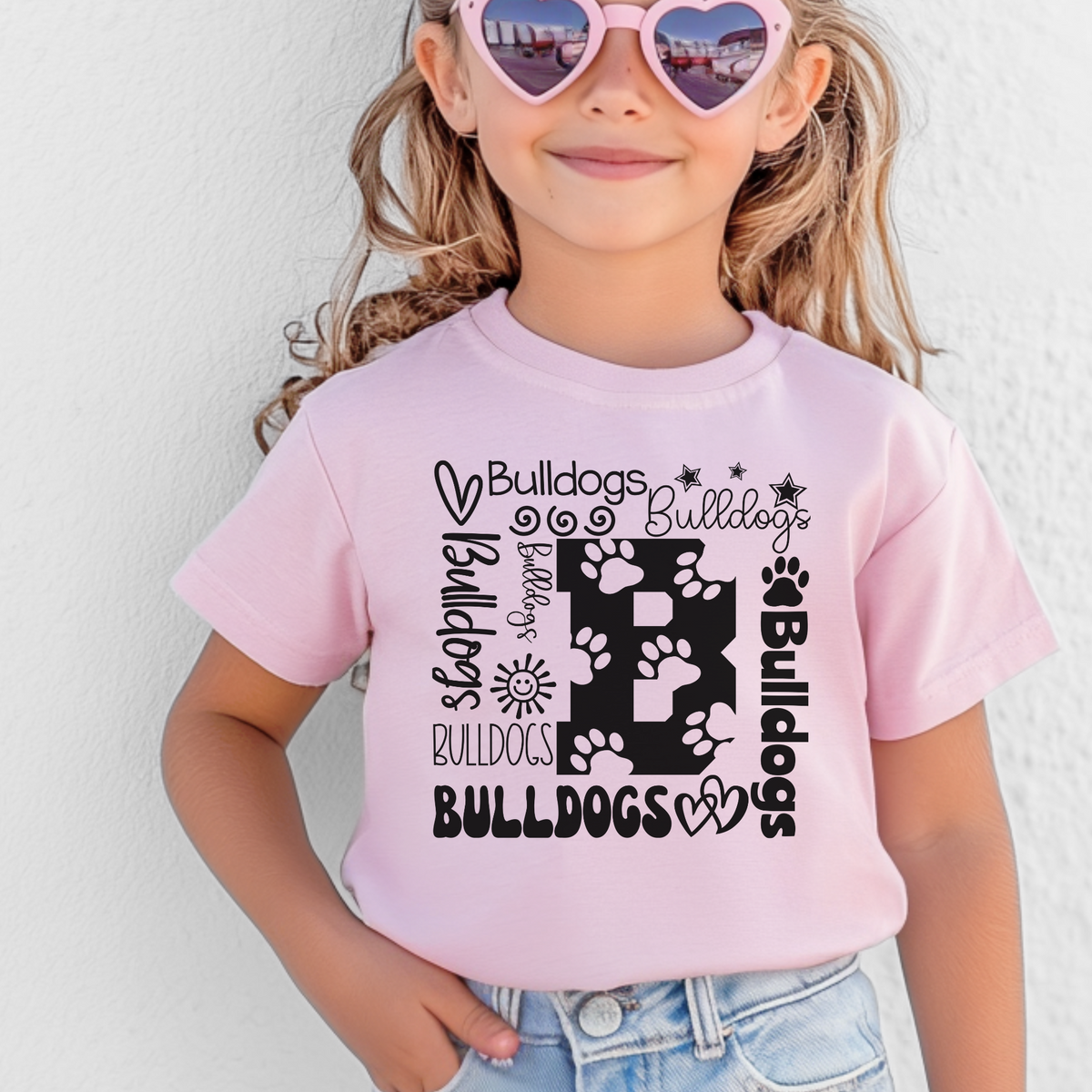 Bulldogs B collage design on Pink Bella Canvas 3001Y youth T-shirt