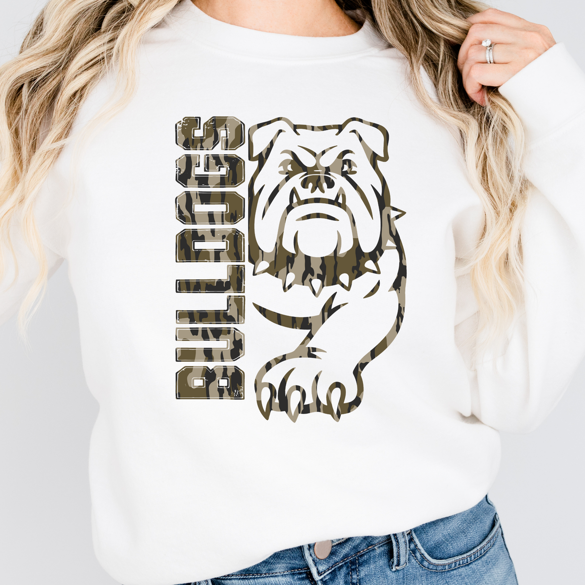 Woman wearing a White Camo Bulldogs full mascot sweatshirt