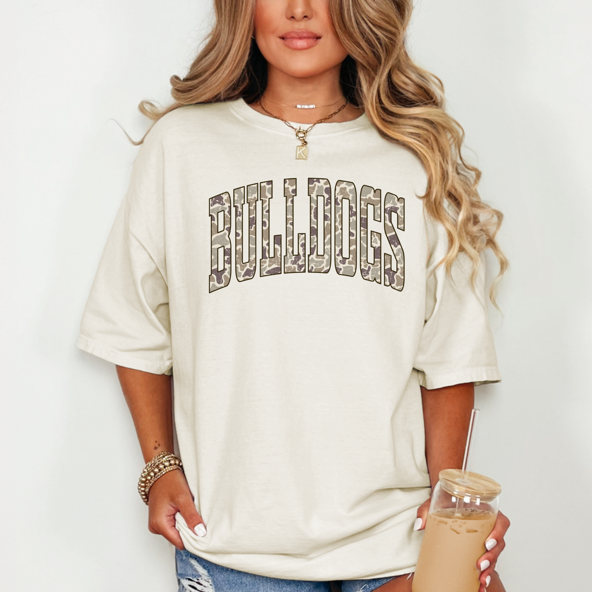 Woman wearing an Ivory Camo BULLDOGS graphic T-shirt