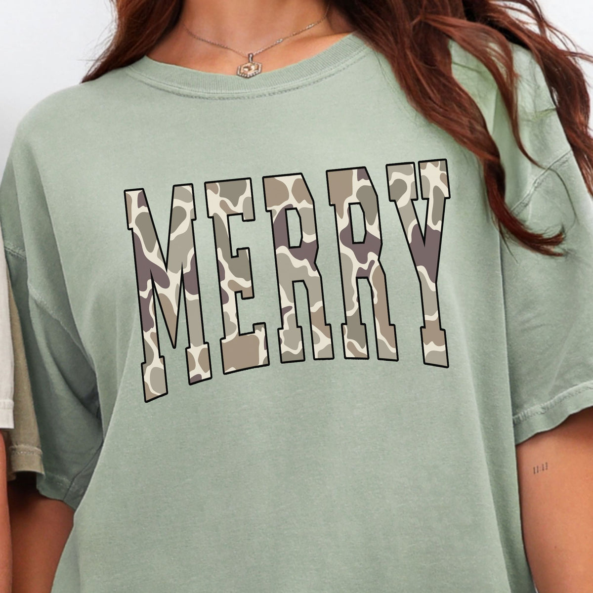 Camo MERRY varsity lettering on a Bay T-shirt