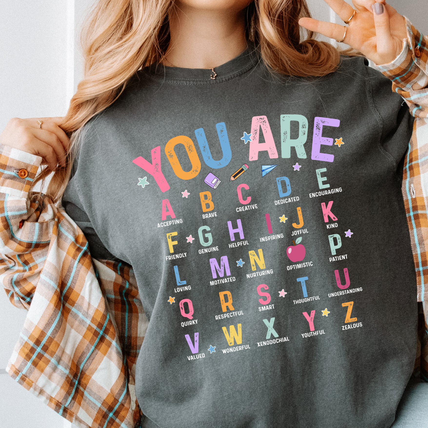 a woman wearing a t - shirt that says you are abcd