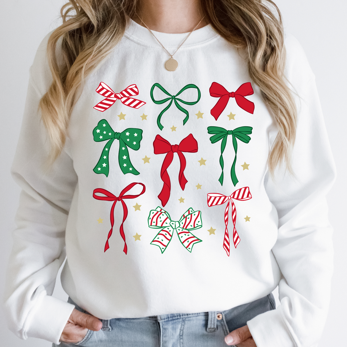 Christmas bow collage design on a white crewneck sweatshirt