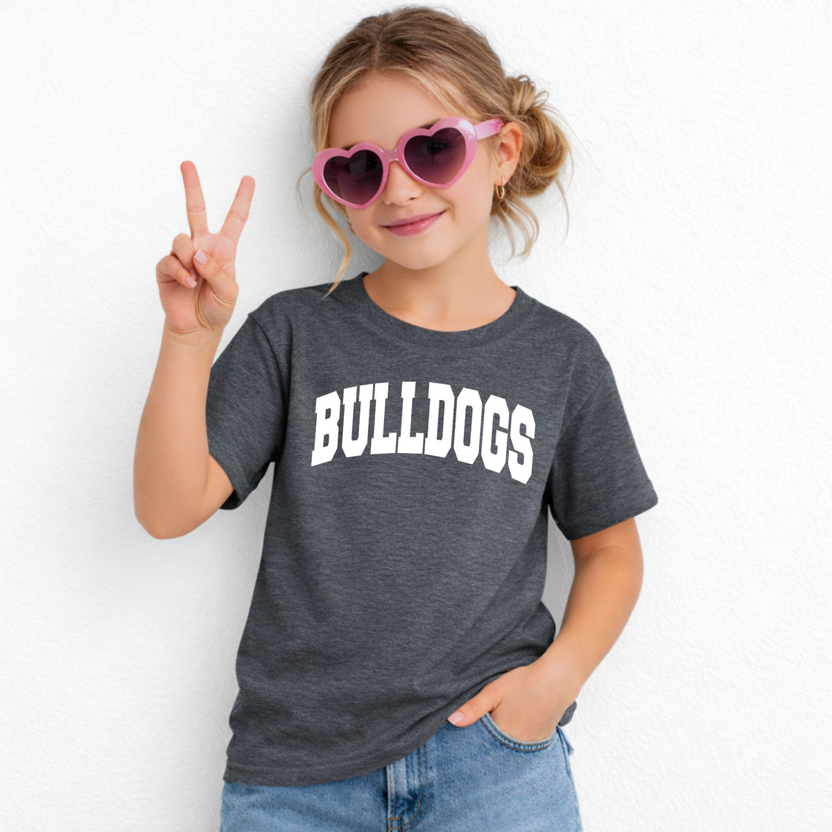 Dark Heather Gildan 5000B youth tee with white collegiate Bulldogs wordmark