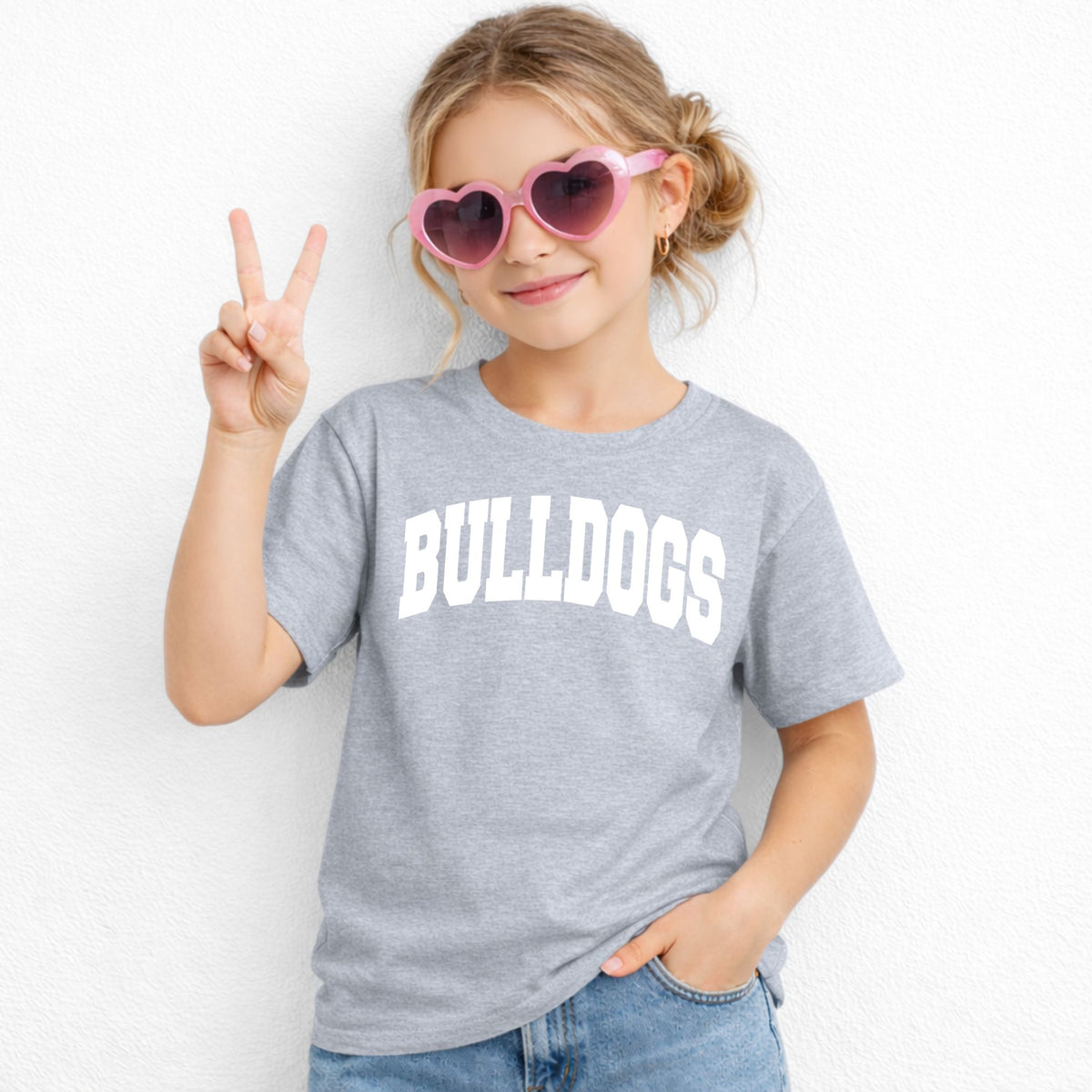 Grey Gildan 5000B youth tee with white collegiate Bulldogs wordmark