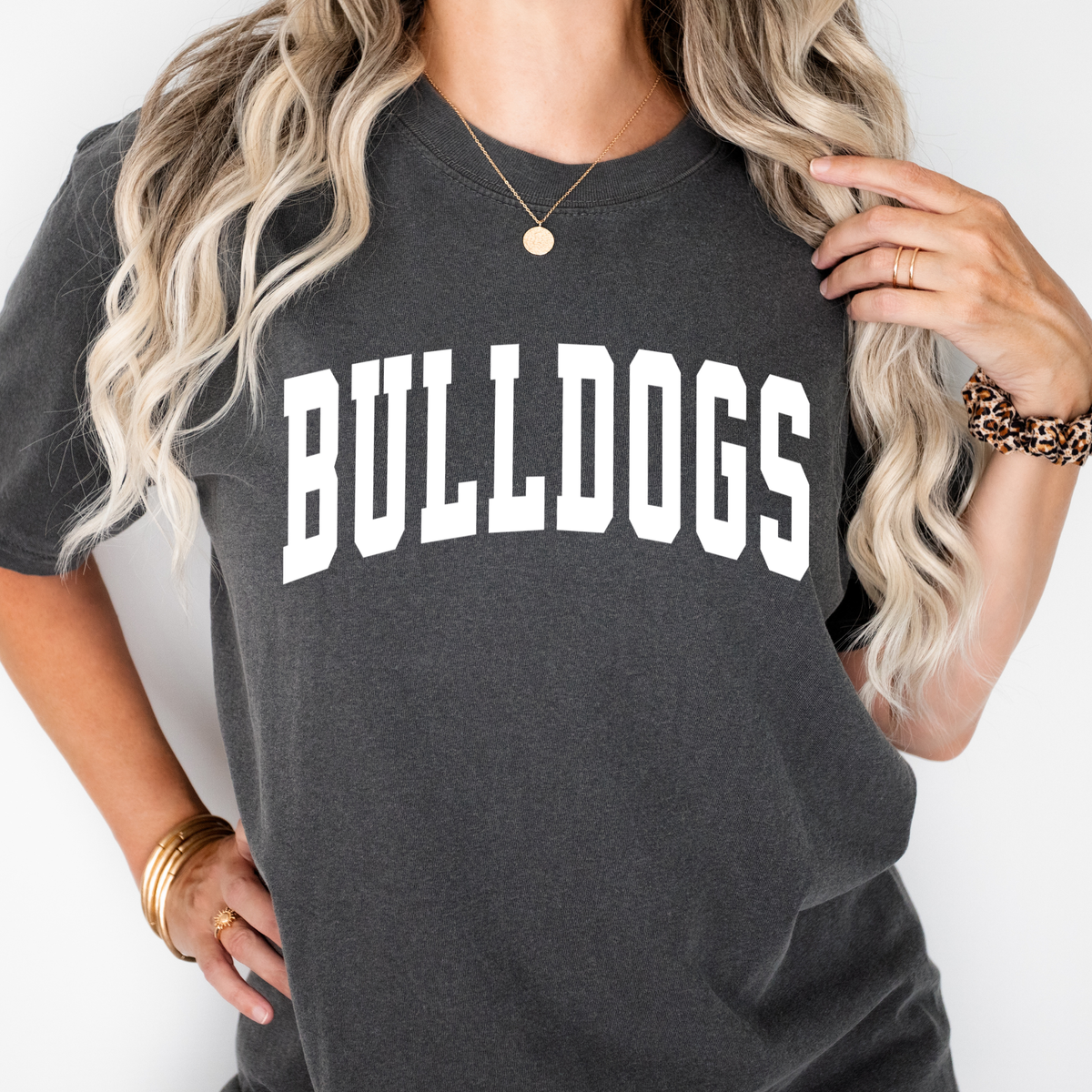 Woman wearing a Pepper Collegiate Bulldogs graphic T-shirt
