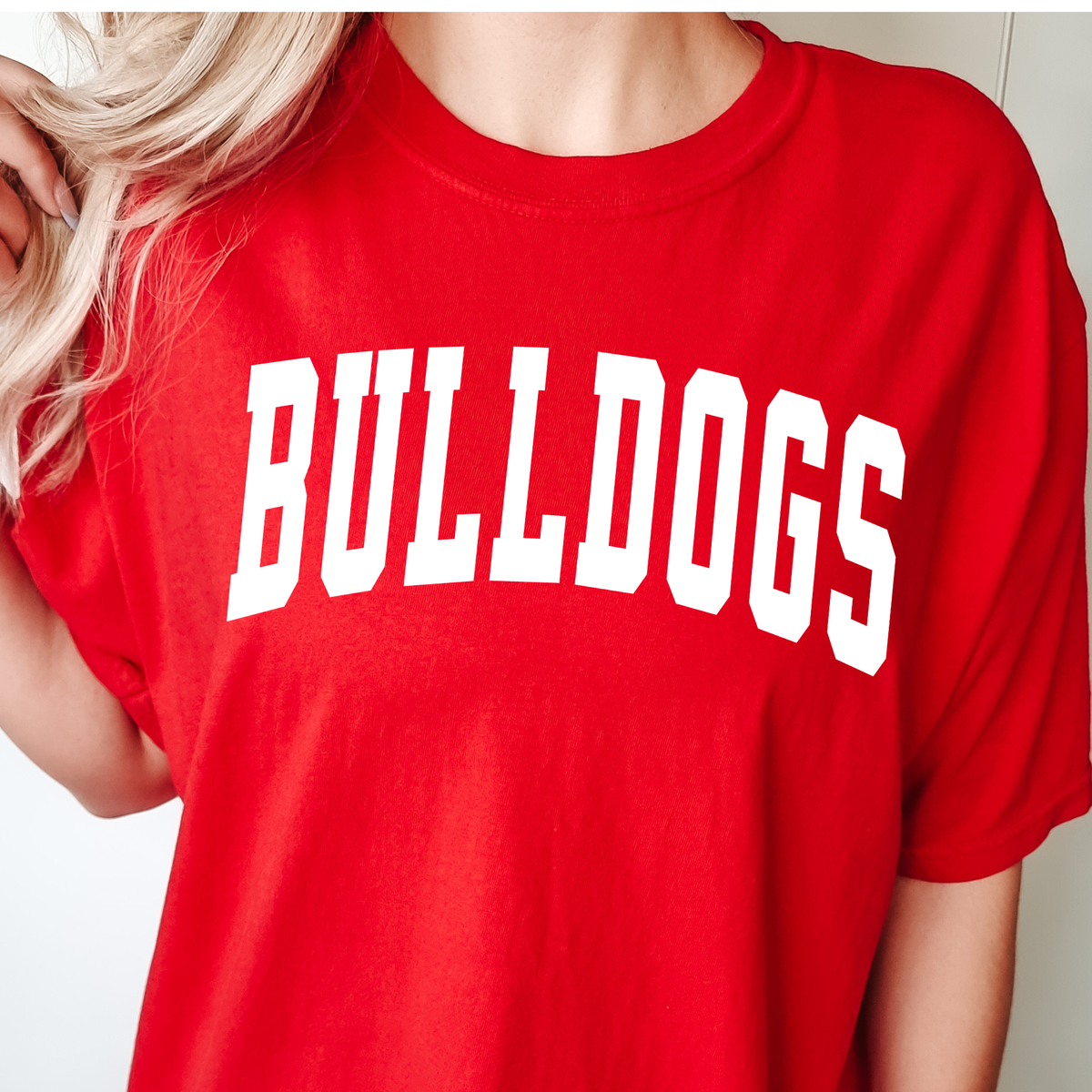 Woman wearing a Red Collegiate Bulldogs graphic T-shirt