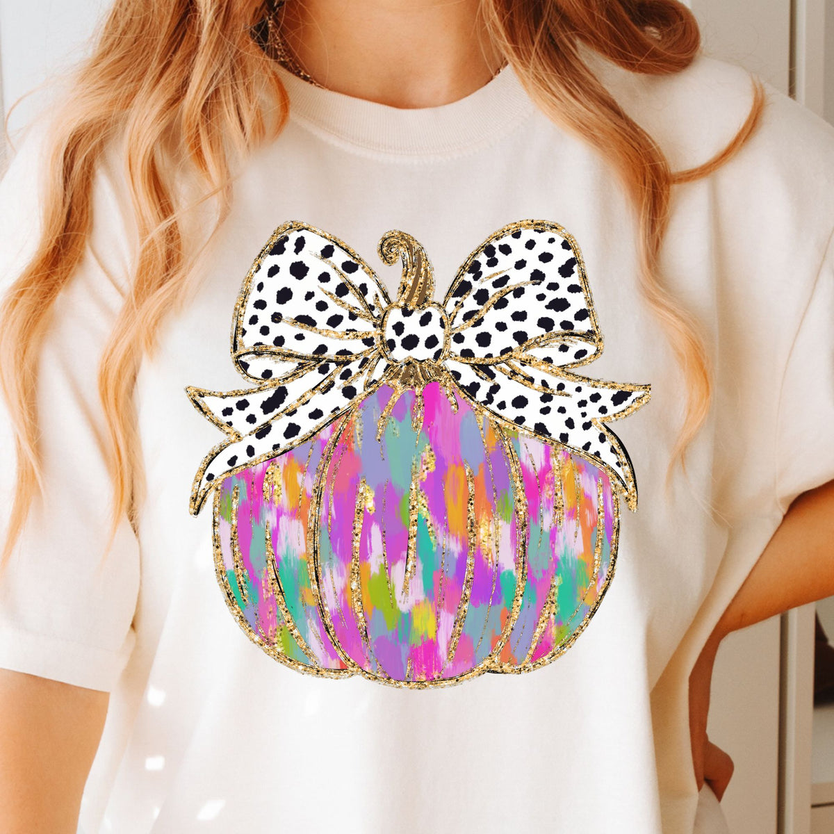 Colorful pumpkin with spotted bow on Ivory T-shirt