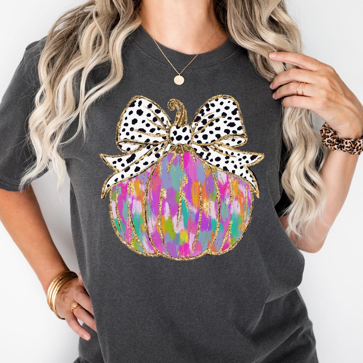 Colorful pumpkin with spotted bow on Pepper T-shirt