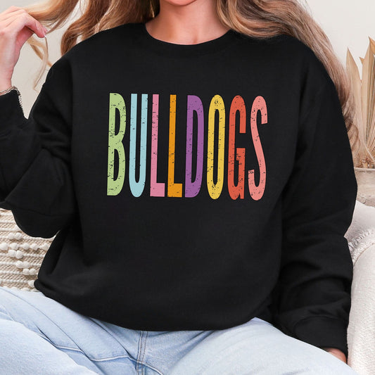 Colorful distressed Bulldogs lettering on a black crewneck sweatshirt