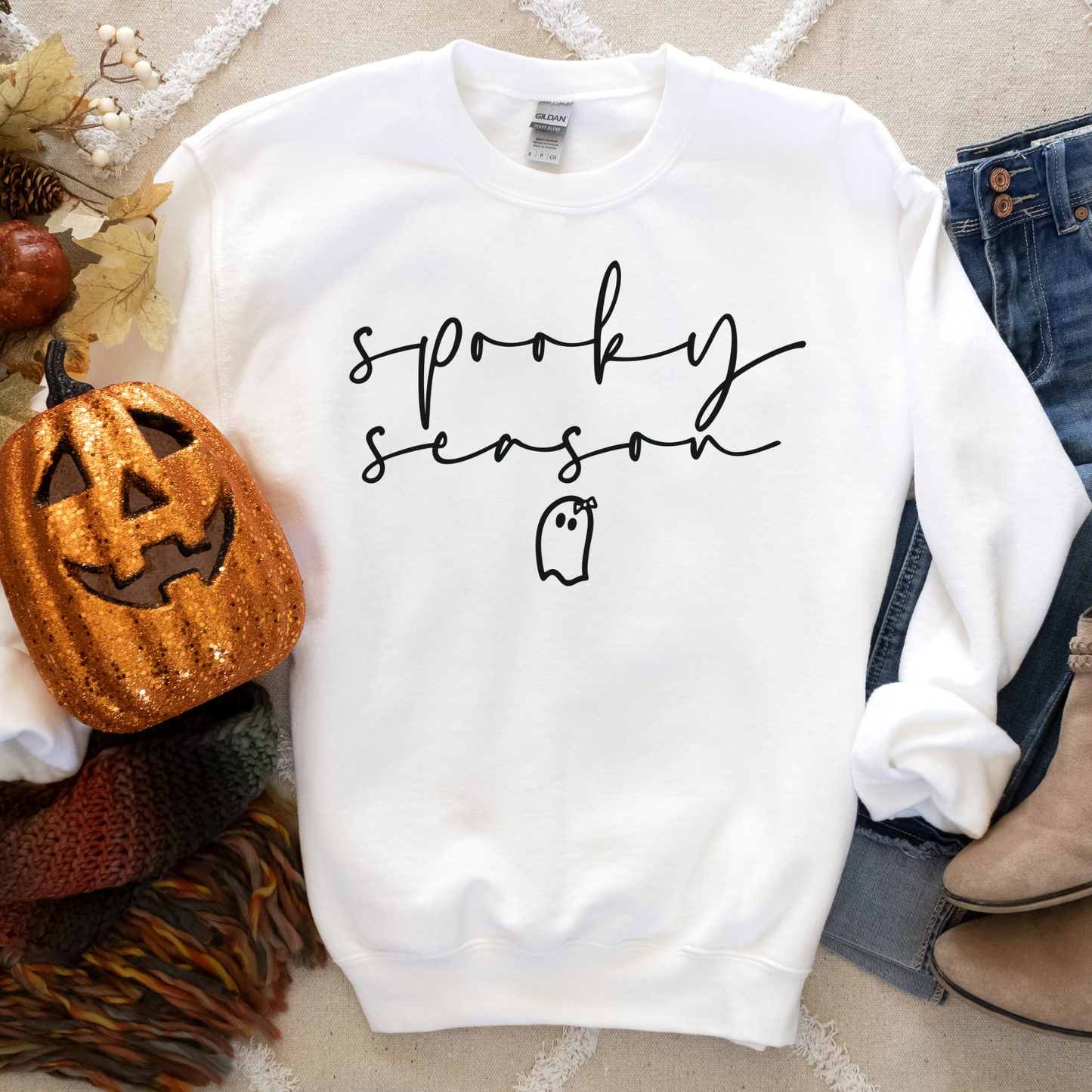 a white sweatshirt with the words spooky spooky on it