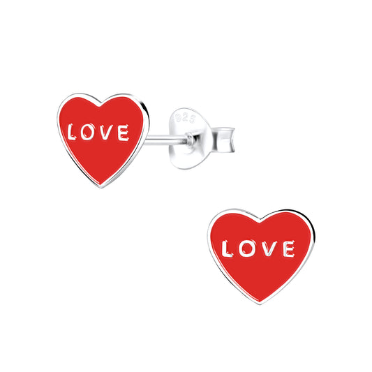 a pair of red heart shaped earrings on a white background