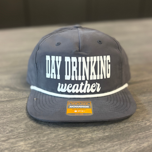 A gray baseball cap with the text "DAY DRINKING WEATHER" printed on it.