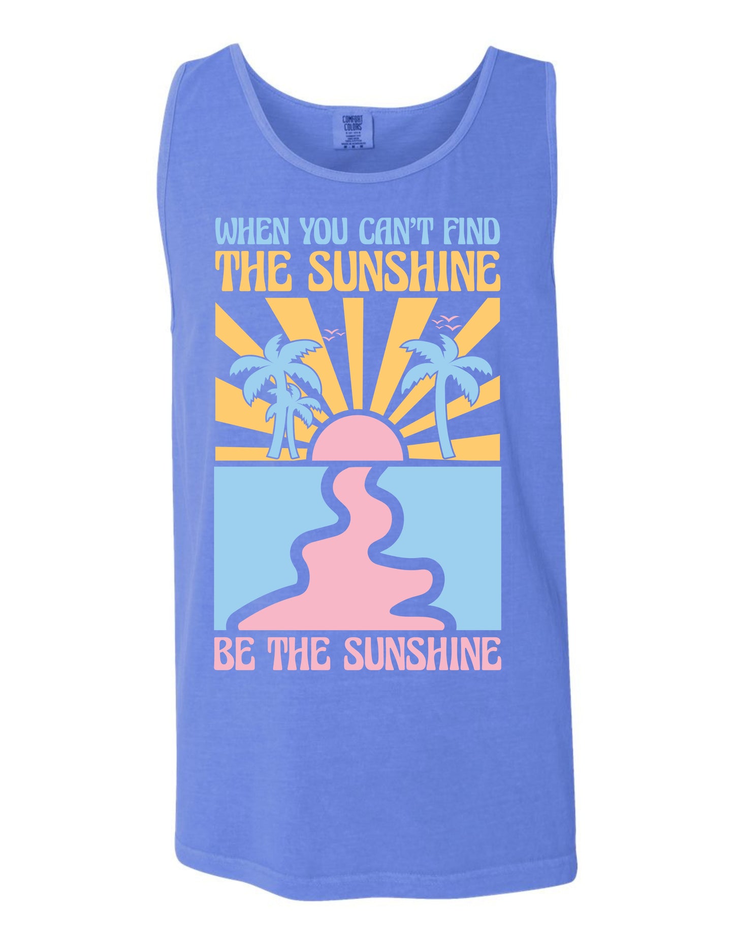 A blue tank top with a graphic design featuring a sun and palm trees, along with the text "When you can't find the sunshine, be the sunshine" printed on it.