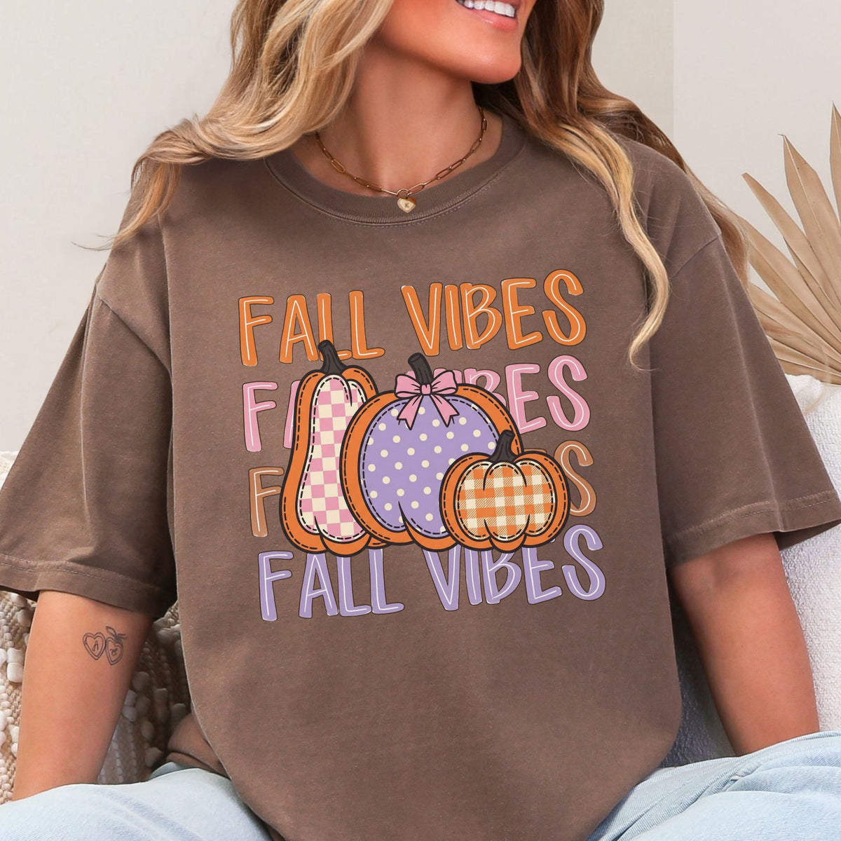 Fall Vibes lettering with checkered, polka-dot and gingham pumpkins on Espresso T-shirt