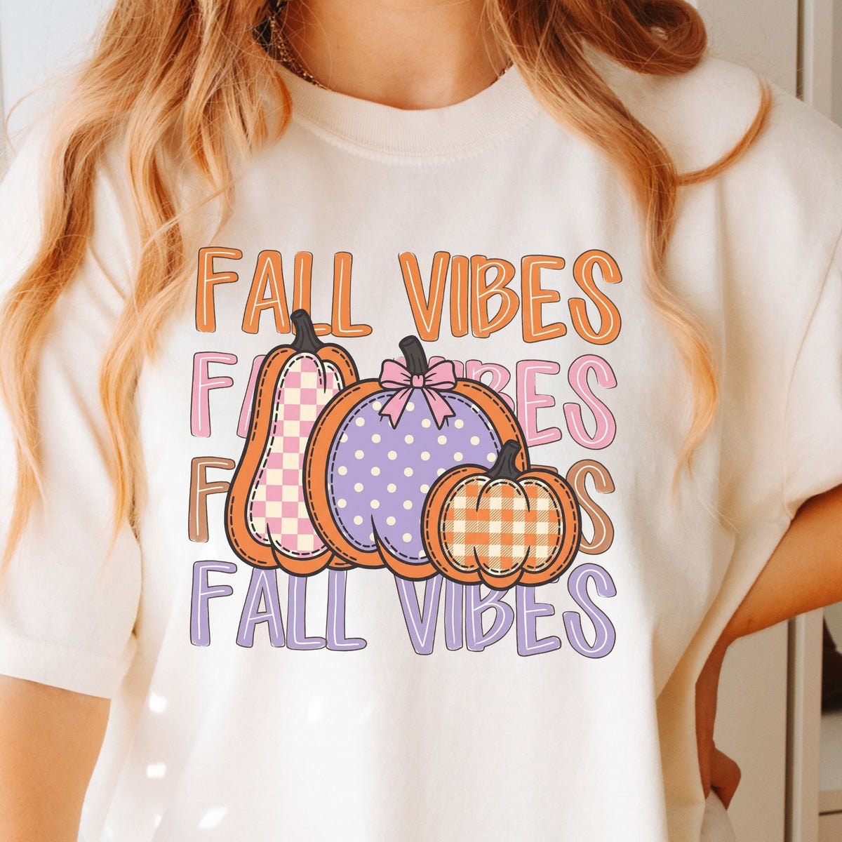 Fall Vibes lettering with checkered, polka-dot and gingham pumpkins on Ivory T-shirt