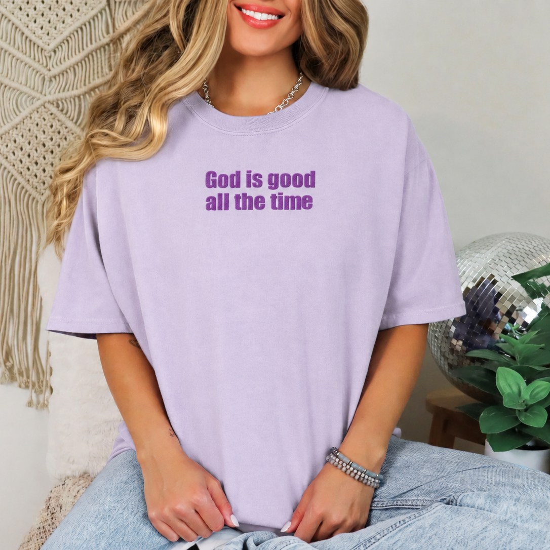 Woman wearing an orchid God Is Good All the Time Christian T-shirt