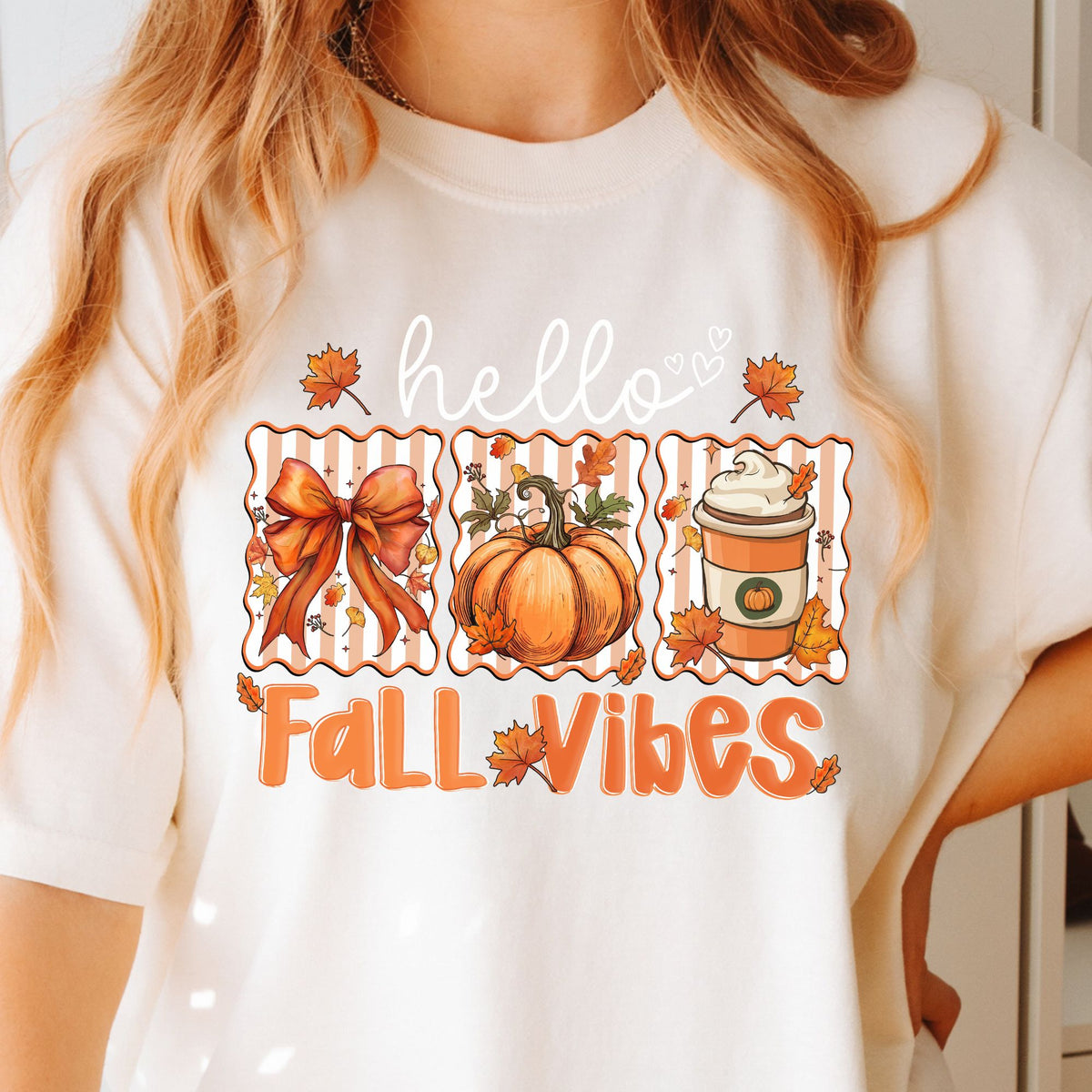 Hello Fall Vibes bow, pumpkin, and latte design on a Ivory T-shirt