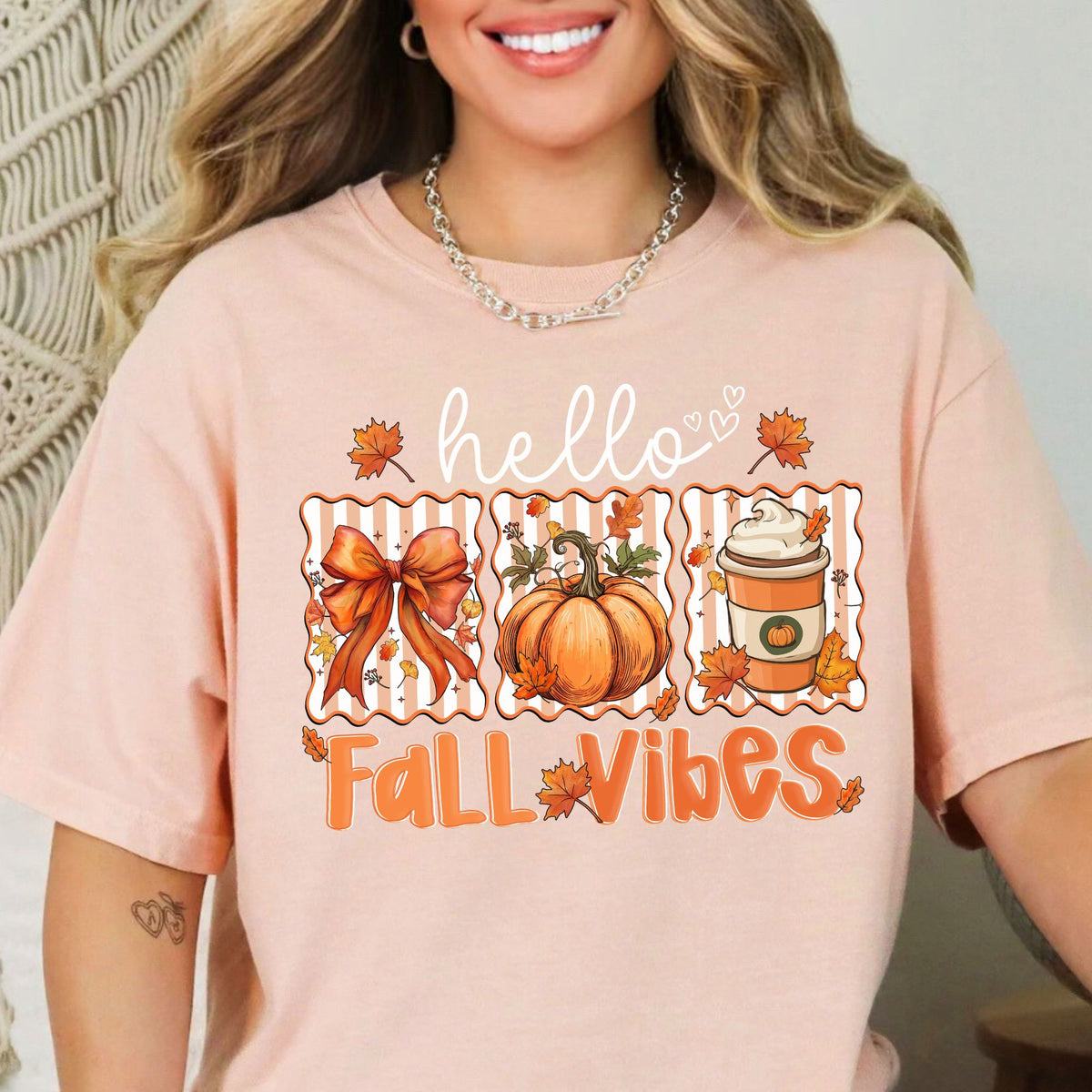 Hello Fall Vibes bow, pumpkin, and latte design on a Peachy T-shirt