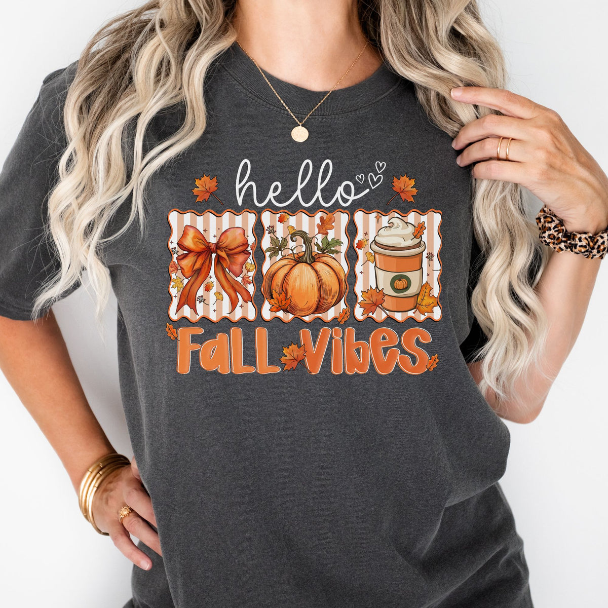 Hello Fall Vibes bow, pumpkin, and latte design on a Pepper T-shirt