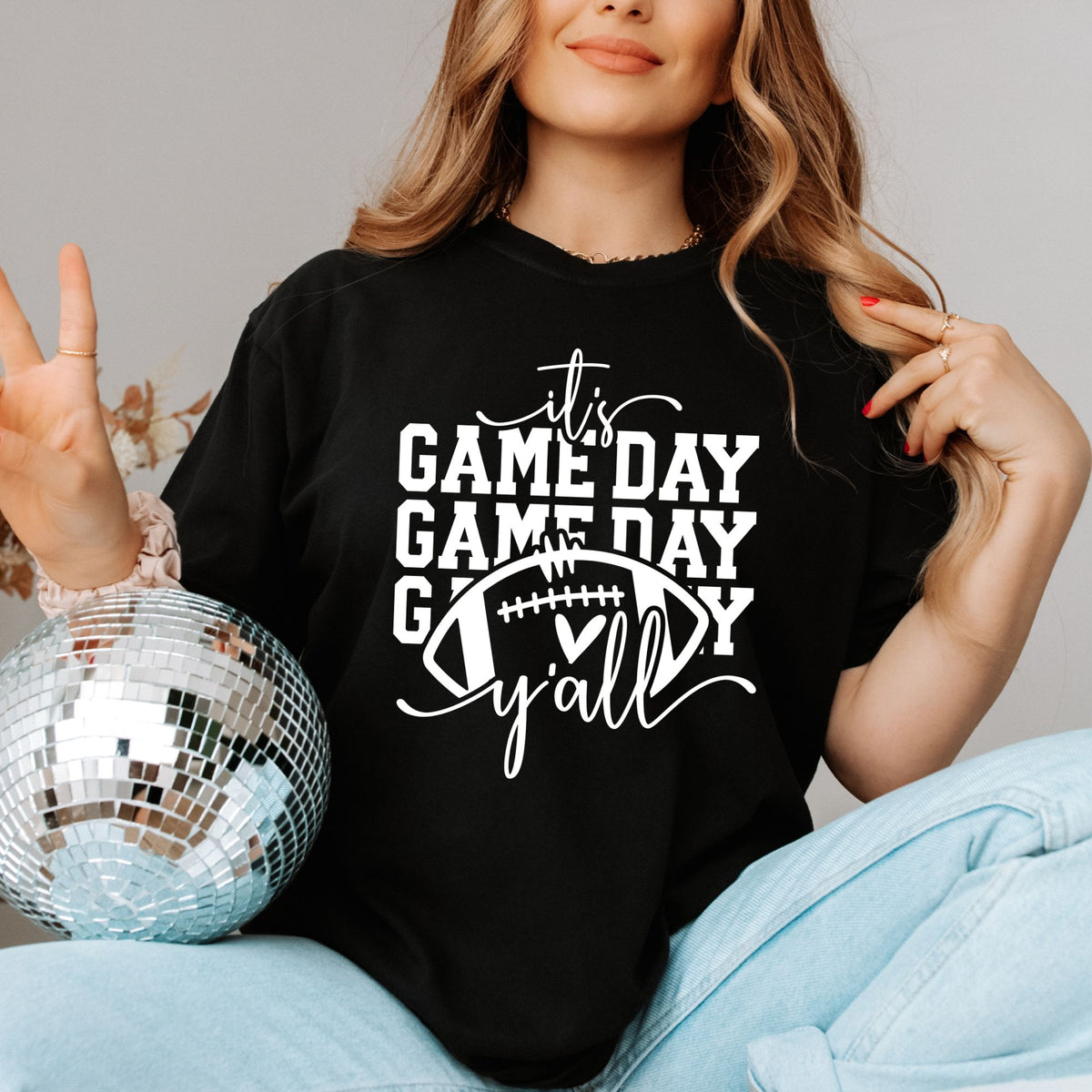 It's Game Day Y'all football graphic on Black Comfort Colors 1717 tee