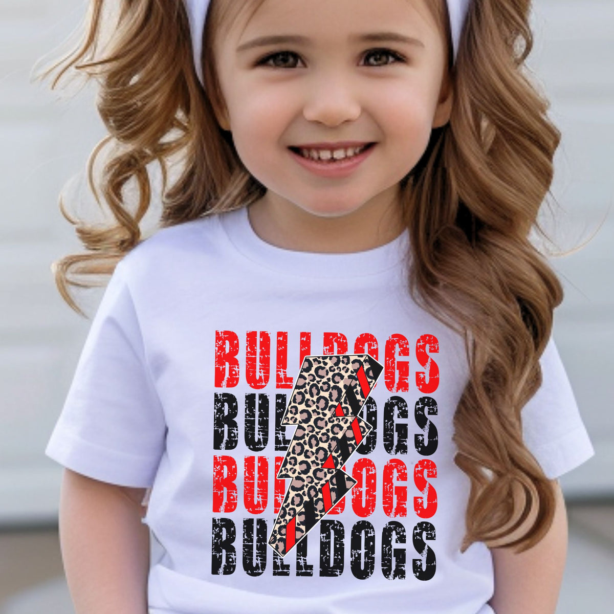 Child wearing White Bulldogs leopard lightning bolt toddler tee