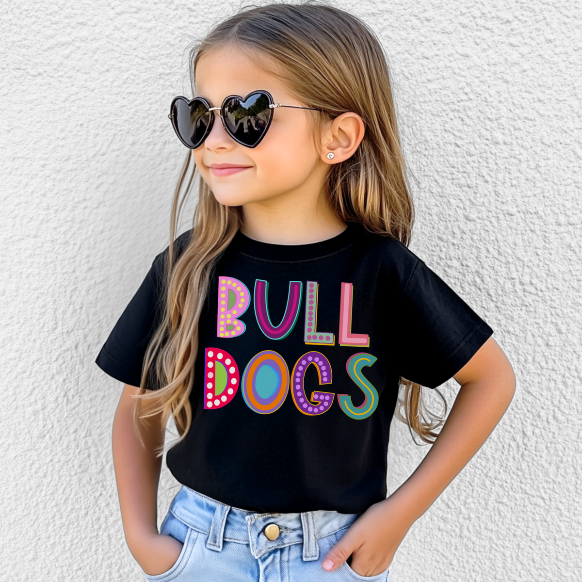 Girl wearing a Black Bella Canvas 3001Y Marquee Bulldogs youth T-shirt