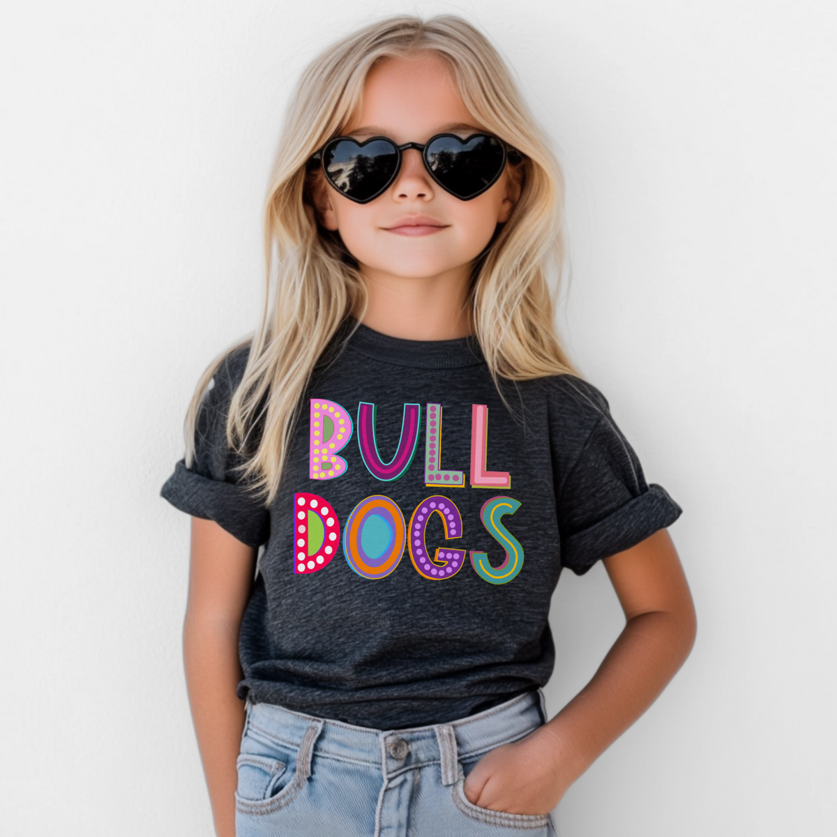 Girl wearing a Dark Grey Bella Canvas 3001Y Marquee Bulldogs youth T-shirt