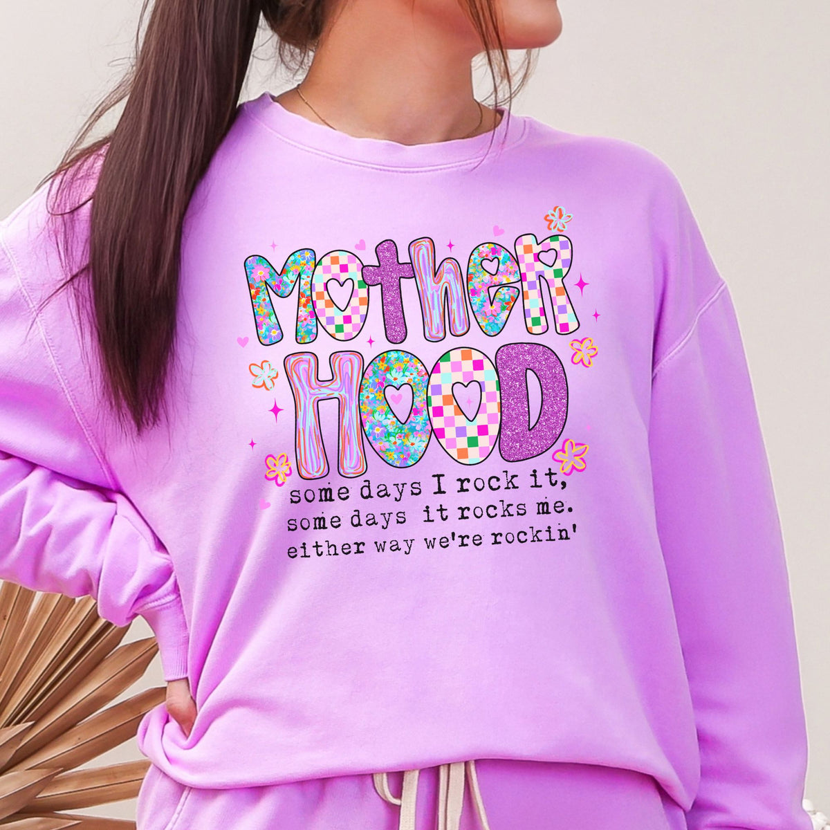 Close view of the Mother Hood design on a Neon Violet sweatshirt
