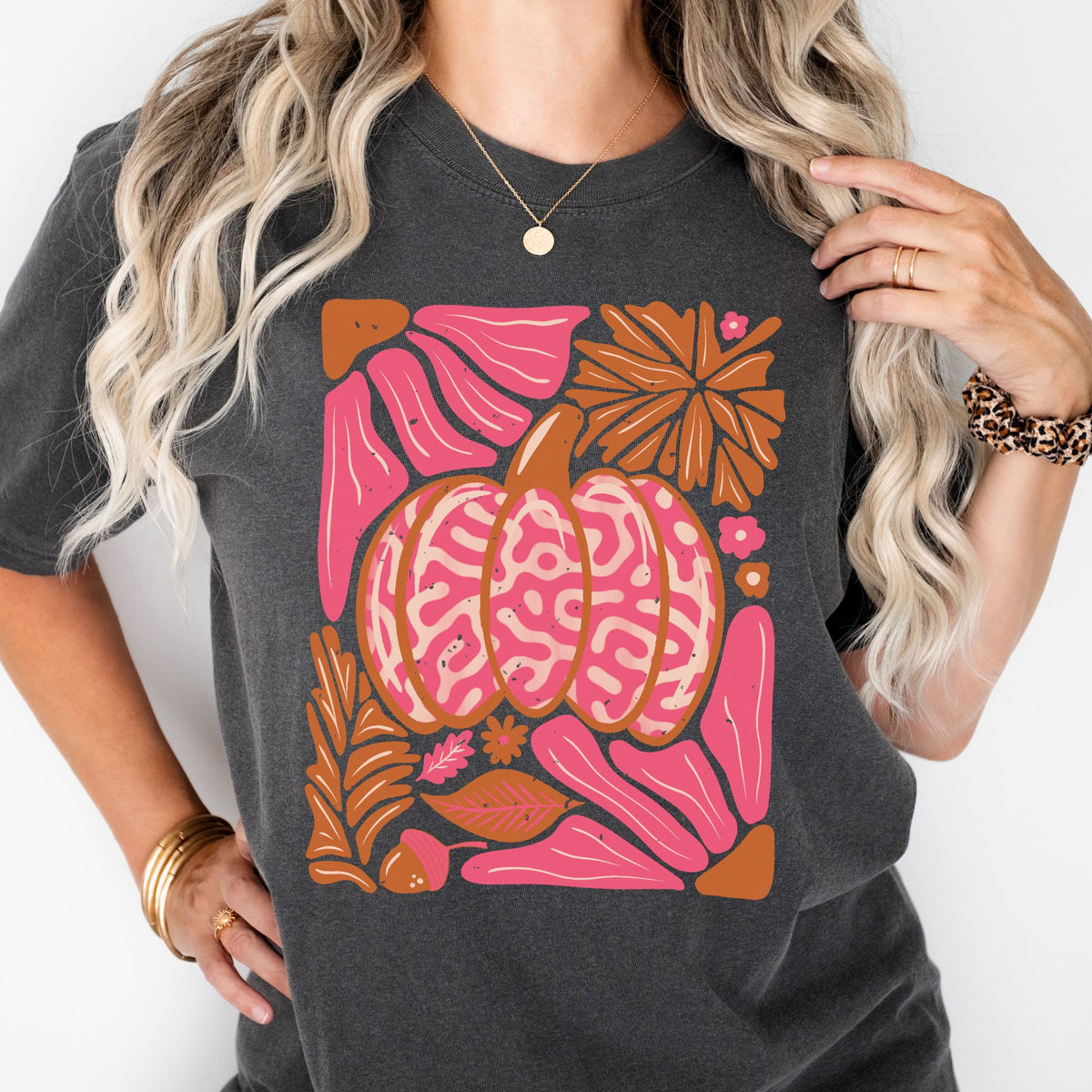 Pink patterned pumpkin with autumn leaves on a Pepper T-shirt