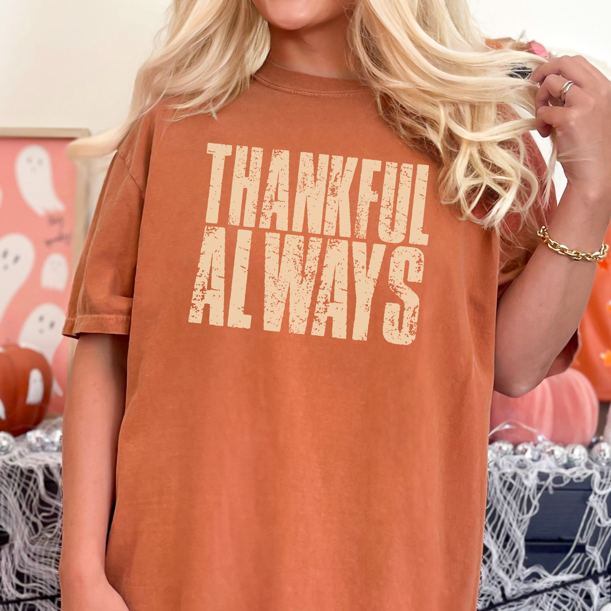 Woman wearing a yam-colored Thankful Always fall T-shirt