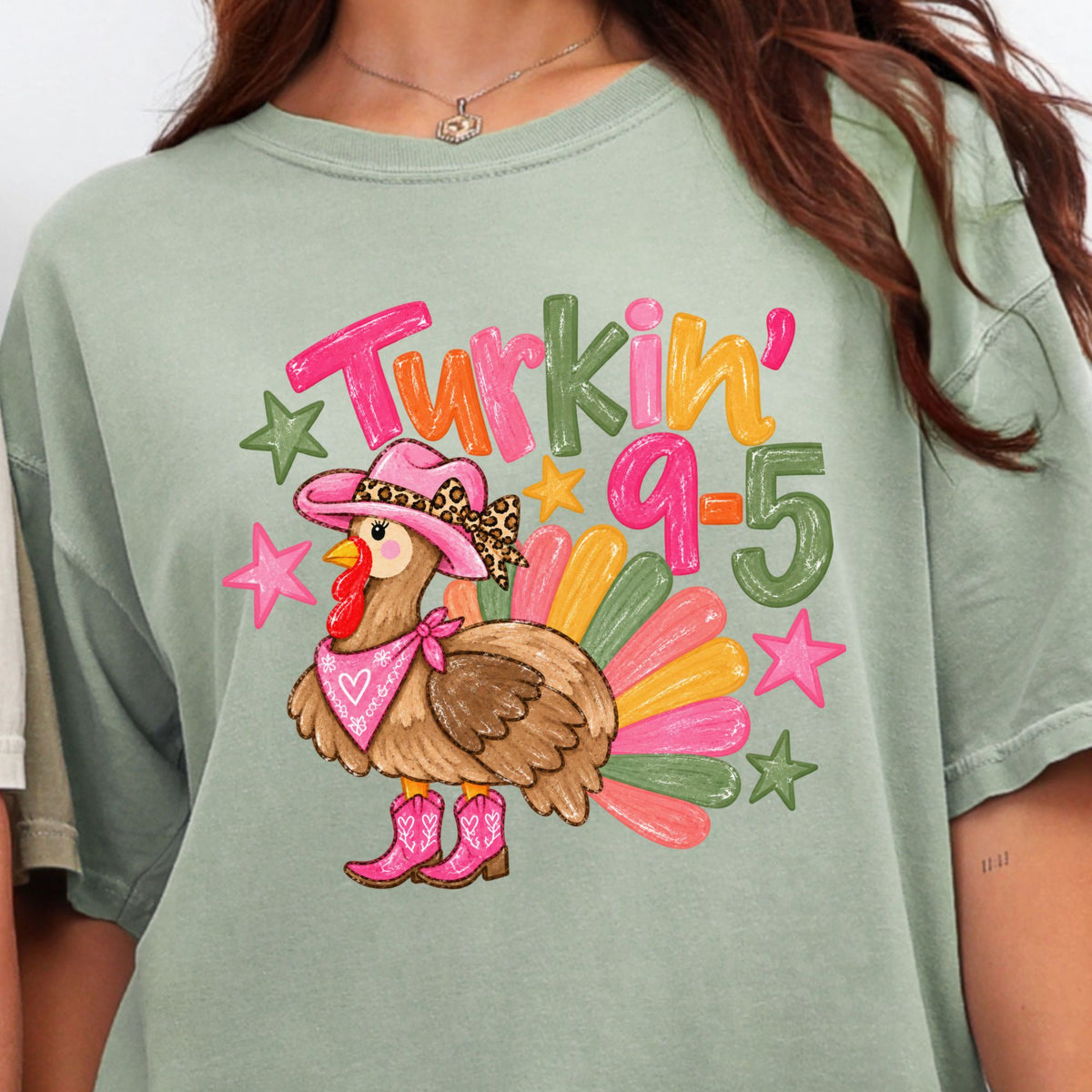Cowgirl turkey in pink boots with Turkin’ 9–5 lettering on a Bay T-shirt