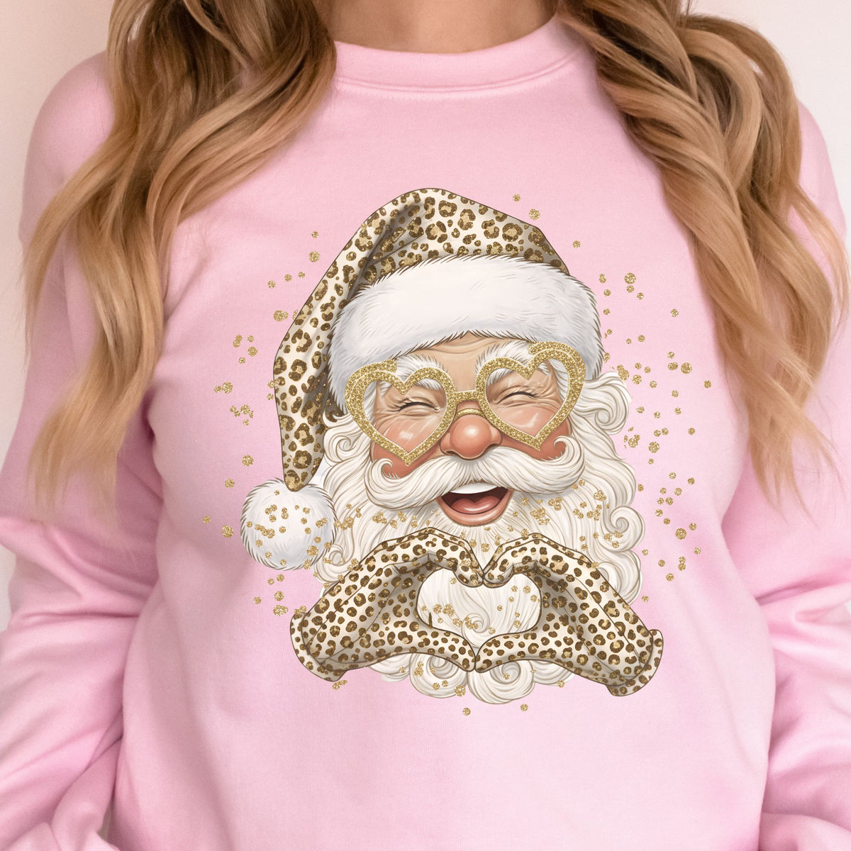 Leopard print Santa design on a light pink crewneck sweatshirt