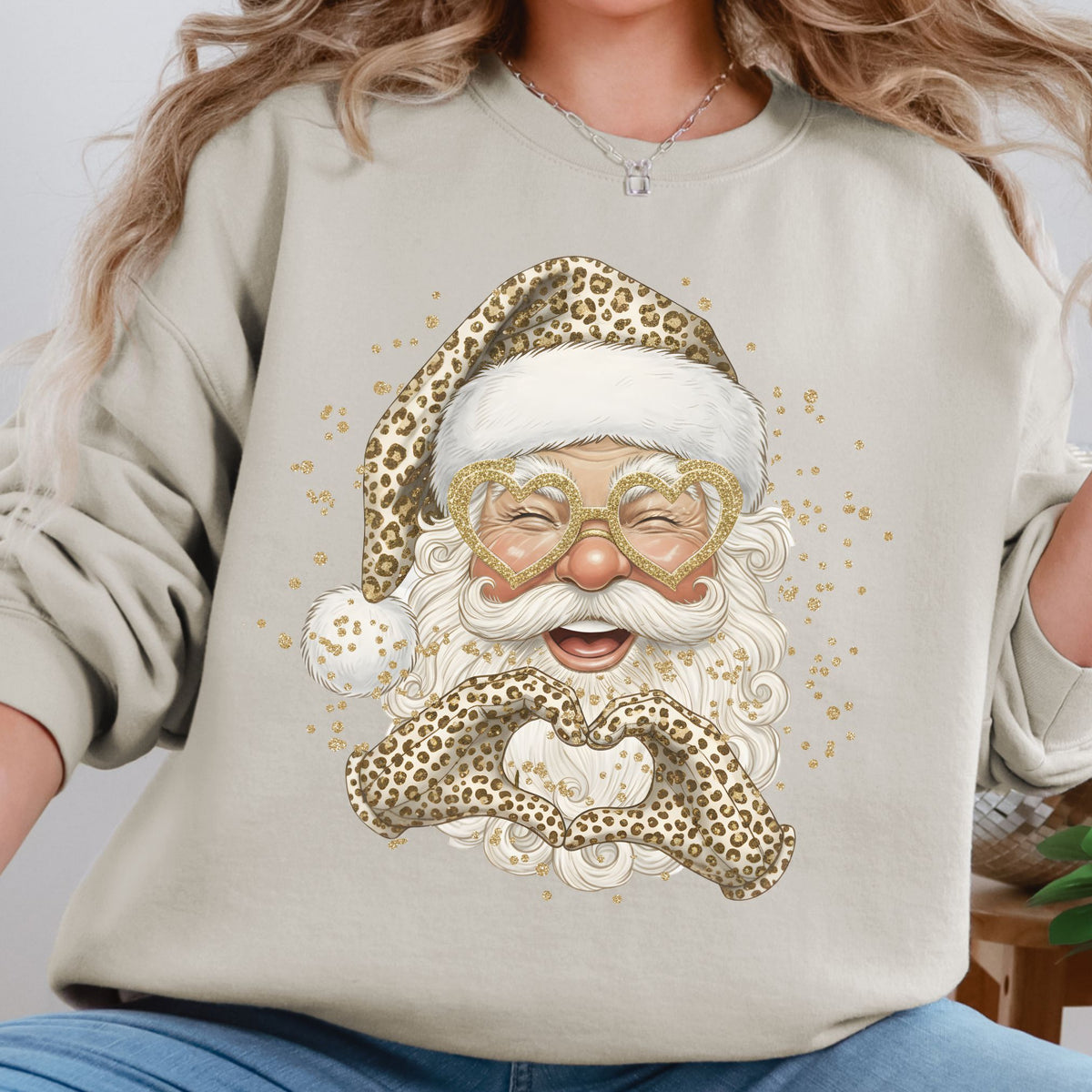 Leopard print Santa design on a sand crewneck sweatshirt